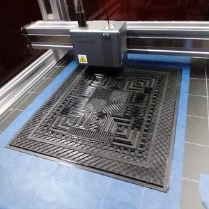 PETG Face plate being printed with a solid first layer and a significant skirt to eliminate warping.