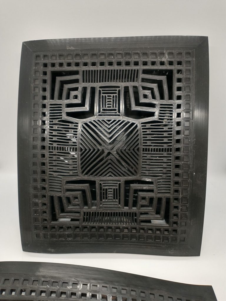 Detail of the front face of the heat distorted grate, showing bends in all the major structures.