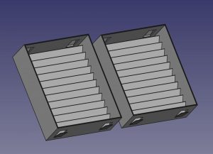 3D renderings of two mounting boxes. The boxes have diagonal vanes on the rear and tabs extend on the top and bottom to hold them in position.