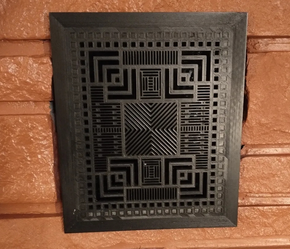 The second version of the grate, printed in PETG, painted, and installed in the fireplace.